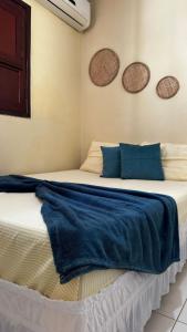 Ένα ή περισσότερα κρεβάτια σε δωμάτιο στο Casa em Marechal Deodoro-Piscina-3Qt-Ar Condicionado-Grupos-Famílias +43 φωτογραφίες