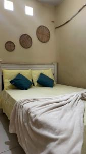 Ένα ή περισσότερα κρεβάτια σε δωμάτιο στο Casa em Marechal Deodoro-Piscina-3Qt-Ar Condicionado-Grupos-Famílias