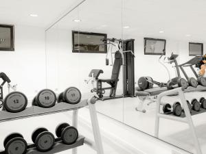 a room with a bunch of clocks and weights at IBIS Port de plaisance in Caen