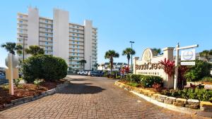 a street in front of a hotel with a building at Beachcrest 903 in Santa Rosa Beach