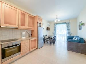 a kitchen and living room with a dining room at Antonio 50 - Blue Glyfada Private Homes in Glyfada +25 photos