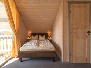 Ένα ή περισσότερα κρεβάτια σε δωμάτιο στο skandinavisches Ferienhaus in Rechlin