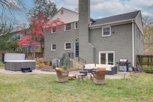 a house with a yard with chairs and a grill at Upscale Family Retreat Near DC and Georgetown! in North Bethesda