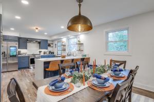 a kitchen and dining room with a table and chairs at Upscale Family Retreat Near DC and Georgetown! in North Bethesda