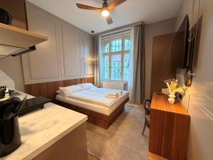 Ένα ή περισσότερα κρεβάτια σε δωμάτιο στο Amaroo - Apartments "Regia"