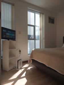 TV a/nebo společenská místnost v ubytování Apartamento Muy céntrico Próximo a Franquicias + 8 fotografií