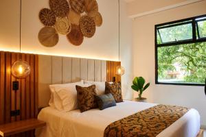 Giường trong phòng chung tại Casa Noral Hotel