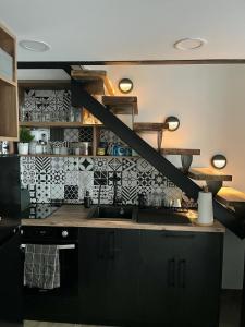 a kitchen with a sink and a counter top at City Loft in Belgrade +2 photos