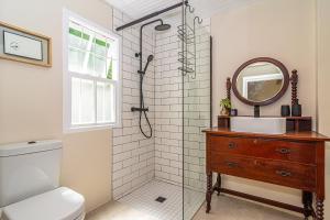 a bathroom with a sink and a mirror at Casa Querida in Stanford +18 photos