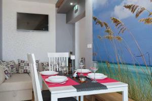TV a/nebo společenská místnost v ubytování Apartments Romantica