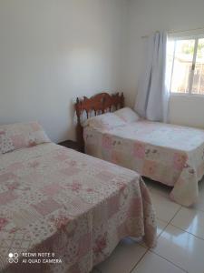 Кровать или кровати в номере casa beija flor