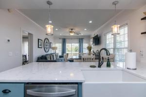 a kitchen and living room with a counter top at Retreat 7B - Jubilee in Edisto Island