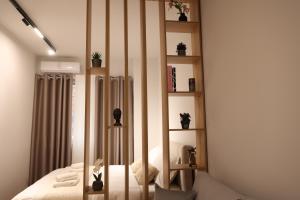 Ένα ή περισσότερα κρεβάτια σε δωμάτιο στο Home 3