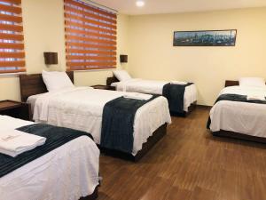 Ένα ή περισσότερα κρεβάτια σε δωμάτιο στο Urban Colonial