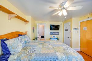 a bedroom with a bed and a ceiling fan at Explore Boardwalk and Beaches! Ocean City Condo in Ocean City +16 photos