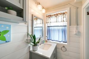 a bathroom with a sink and a mirror at Walk to Beach and Music Pier! Condo in Ocean City in Ocean City +16 photos