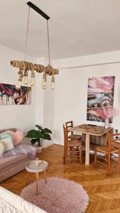 a living room with a couch and a table at Jana's Apartment,100 meters to the lake,Free Parking in Ohrid