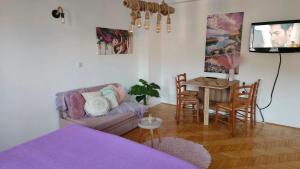 a living room with a couch and a table at Jana's Apartment,100 meters to the lake,Free Parking in Ohrid