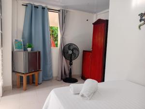 Ένα ή περισσότερα κρεβάτια σε δωμάτιο στο Casa turistica Miss G