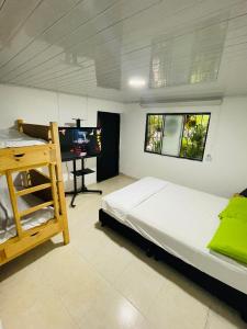 Postel nebo postele na pokoji v ubytování EL NOPAL Hostal