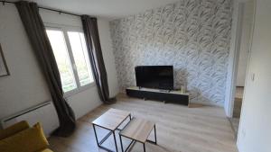 Μια τηλεόραση ή/και κέντρο ψυχαγωγίας στο L'ALPETTE maison 3 pièces 2 chambres