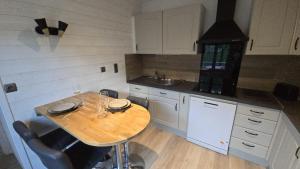 Η κουζίνα ή μικρή κουζίνα στο L'ALPETTE maison 3 pièces 2 chambres