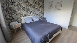 Ένα ή περισσότερα κρεβάτια σε δωμάτιο στο L'ALPETTE maison 3 pièces 2 chambres