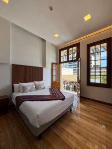 Ένα ή περισσότερα κρεβάτια σε δωμάτιο στο Circasiana Palace Hotel Boutique