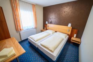 Voodi või voodid majutusasutuse Gasthof - Landhotel Ernst toas +79 fotot