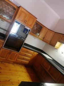 an overhead view of a kitchen with wooden cabinets at Nsimbini 430 Lena Ahrens in Durban