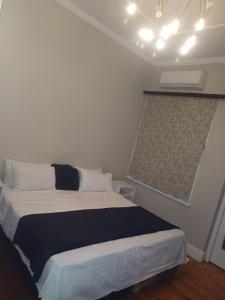 a bedroom with a large bed in a room at Nsimbini 430 Lena Ahrens in Durban +5 photos