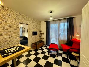 a living room with a checkered floor at LOFT Studio Wielicka in Krakow