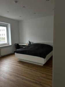 Una cama o camas en una habitación de Gemütliches Zimmer im Herzen der Stadt Neuwied