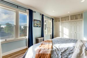 a bedroom with blue walls and windows and a bed at 28 Acres in Wine Country! Central California Oasis in Estrella