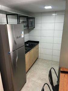 Una cocina o cocineta en Max Suites block A, apartment 002