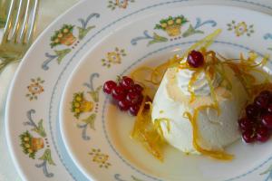 a plate of food with a dessert on a table at Hotel Caparena in Taormina