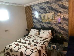 Ένα ή περισσότερα κρεβάτια σε δωμάτιο στο Résidence MUNAM