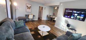 a living room with a couch and a table at Cozy 2bdr Beach home in Huntington Beach