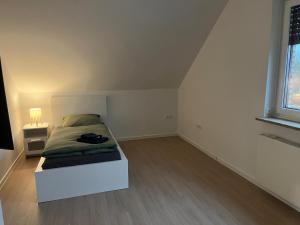 Ένα ή περισσότερα κρεβάτια σε δωμάτιο στο HörnQuartier - modern eingerichtete Ferienwohnung - Familienfreundlich, ideal auch für Geschäftskunden +11 φωτογραφίες