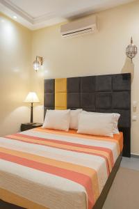 Giường trong phòng chung tại Cycas family apart ground floor parking