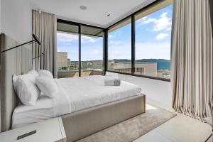 Ένα ή περισσότερα κρεβάτια σε δωμάτιο στο LIOQA Resort +111 φωτογραφίες