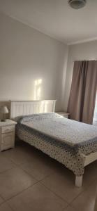 En eller flere senge i et værelse på Pammpa Pinamar