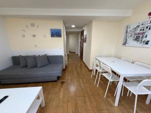 a living room with a couch and a table and chairs at SP 43 Vut in Lugo +53 photos