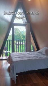 Ένα ή περισσότερα κρεβάτια σε δωμάτιο στο Cabaña Alpina Bella Vista