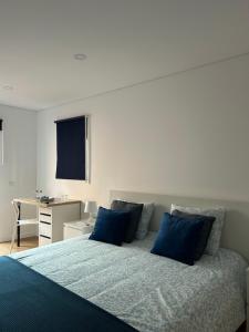 Postel nebo postele na pokoji v ubytování A Casa da Praça - The Square House + 38 fotografií