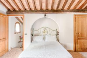 Ένα ή περισσότερα κρεβάτια σε δωμάτιο στο Charming Tuscan Villa Borgo Il Massera