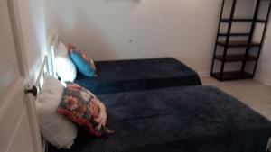 En eller flere senge i et værelse på Résidence Scarlette