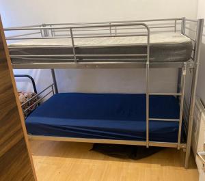 a couple of bunk beds in a room at EAST HAM HOME SHARe in London