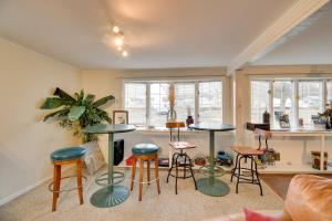 a living room with two tables and stools at Lake Access and Incredible Views at Sodus Bay Home! in North Rose