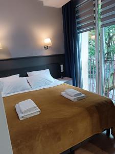 Postel nebo postele na pokoji v ubytování Centrum Apartment na Zamenhofa